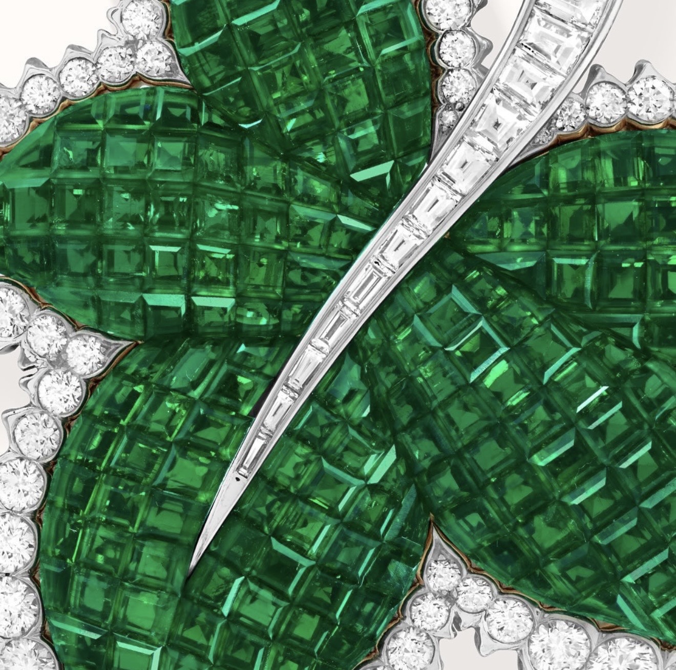 Emerald leaves, each stone cut for its exact place in the design.
