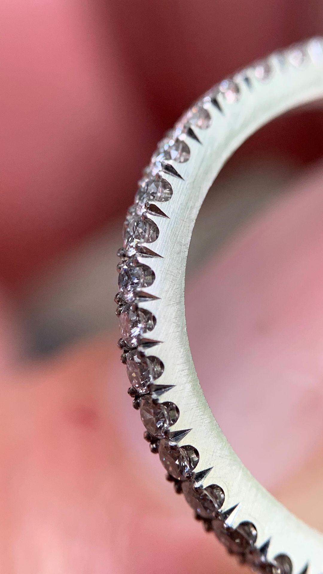 An eternity band, where a fraction of a millimeter decides the whole line.