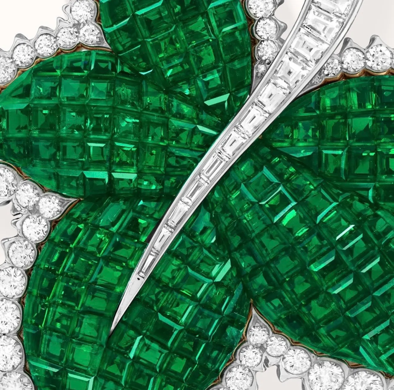 Emerald leaves, each stone cut for its exact place in the design.