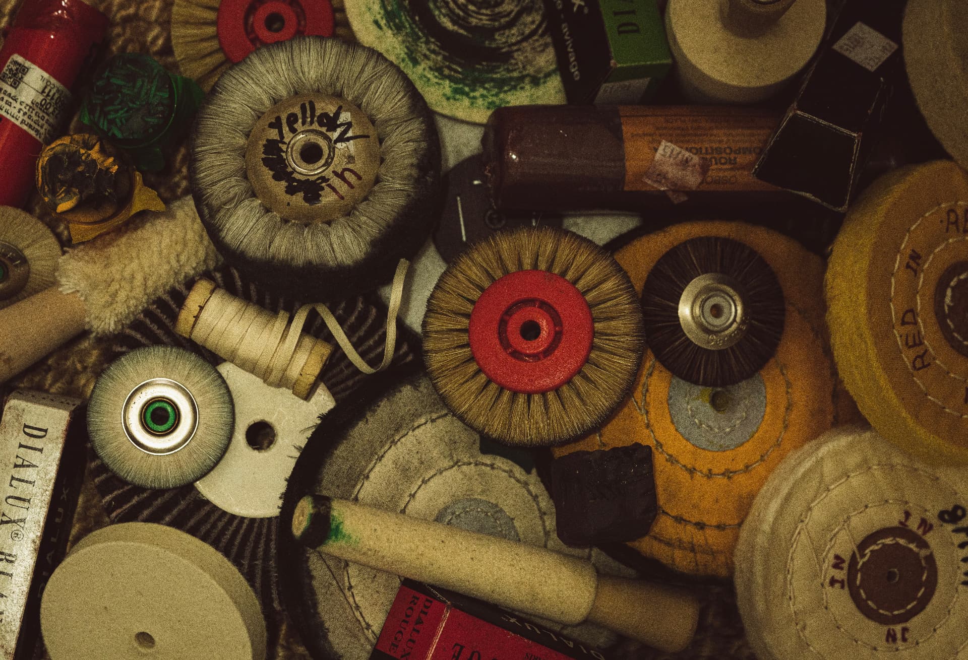 Wheels, brushes and compounds, each with its own purpose at the bench.